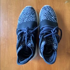 Black snake print adidas tubular sneakers